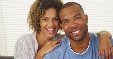 Black man and woman smiling after a tooth extraction, downey ca