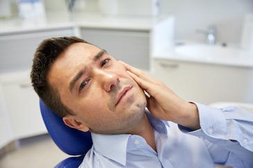 Man in dental chair about to receive root canal treatment, Downey CA