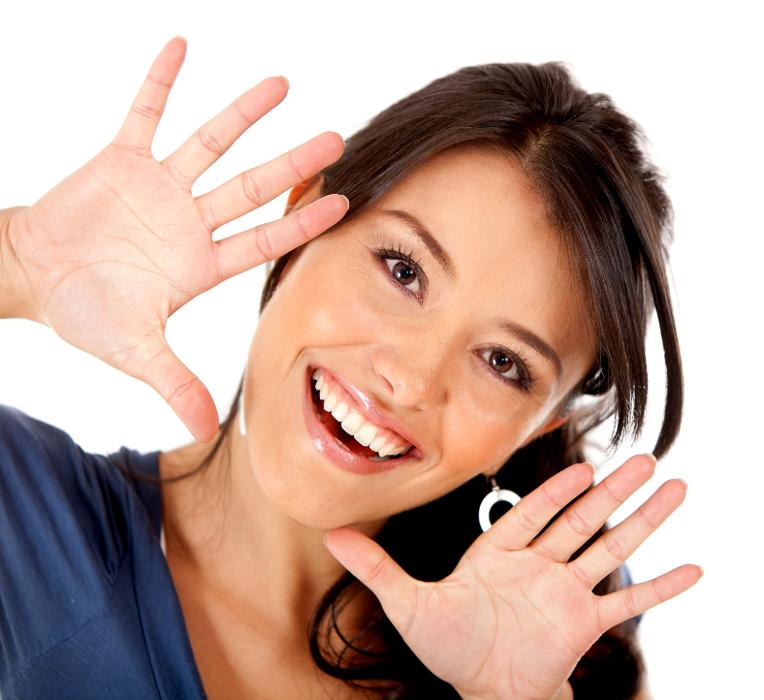 Woman framing her smile after teeth whitening, downey ca