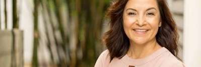 Older woman smiling with dental implants, downey ca