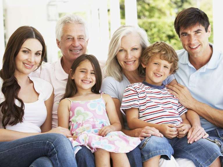 Multi generational family smiling together, downey ca