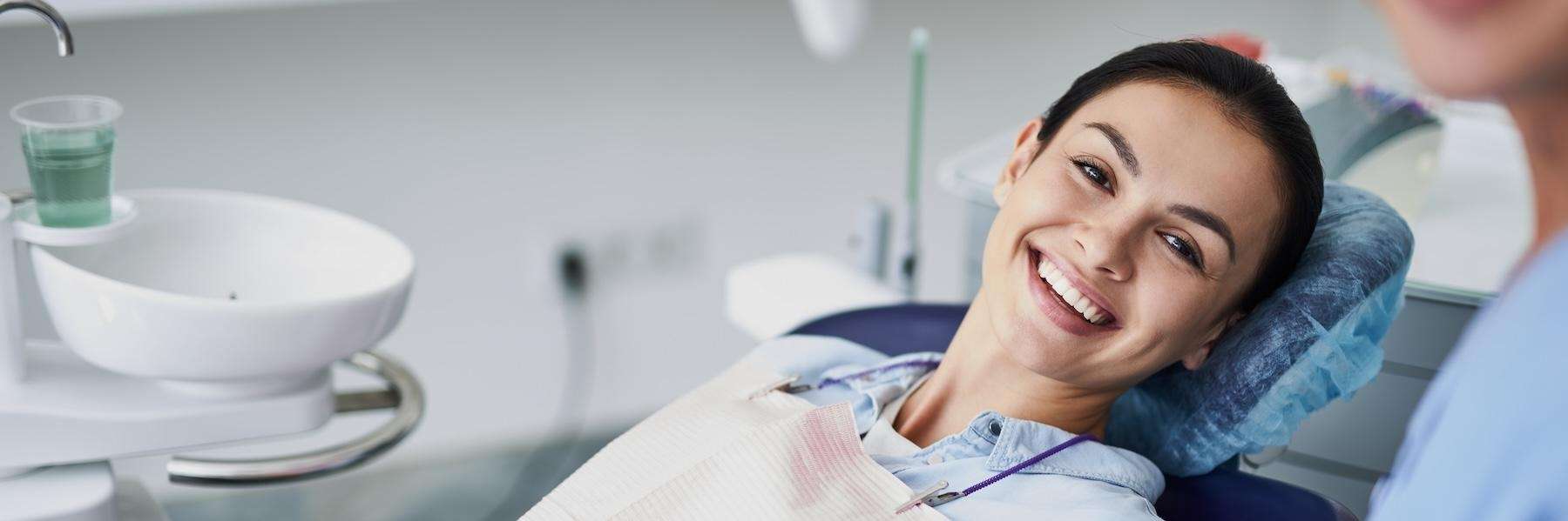 Woman in dental chair after root canal procedure, downey ca