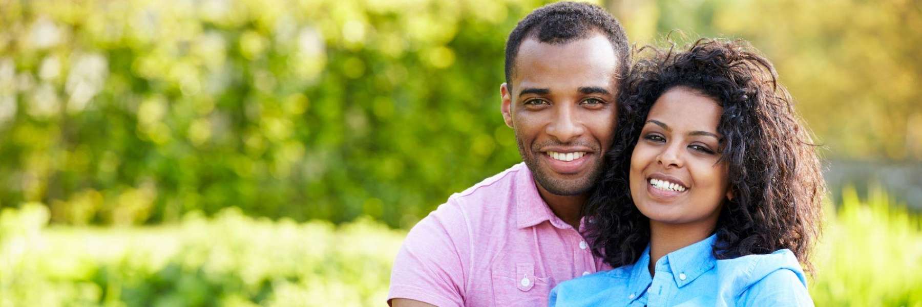 Young black couple smiling together after veneers, downey ca