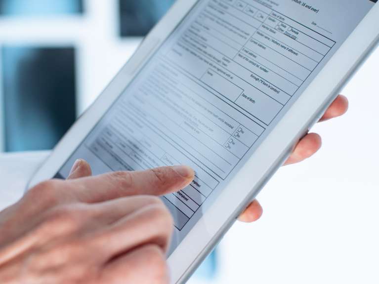 Image of tablet that is displaying digital patient records, Downey CA